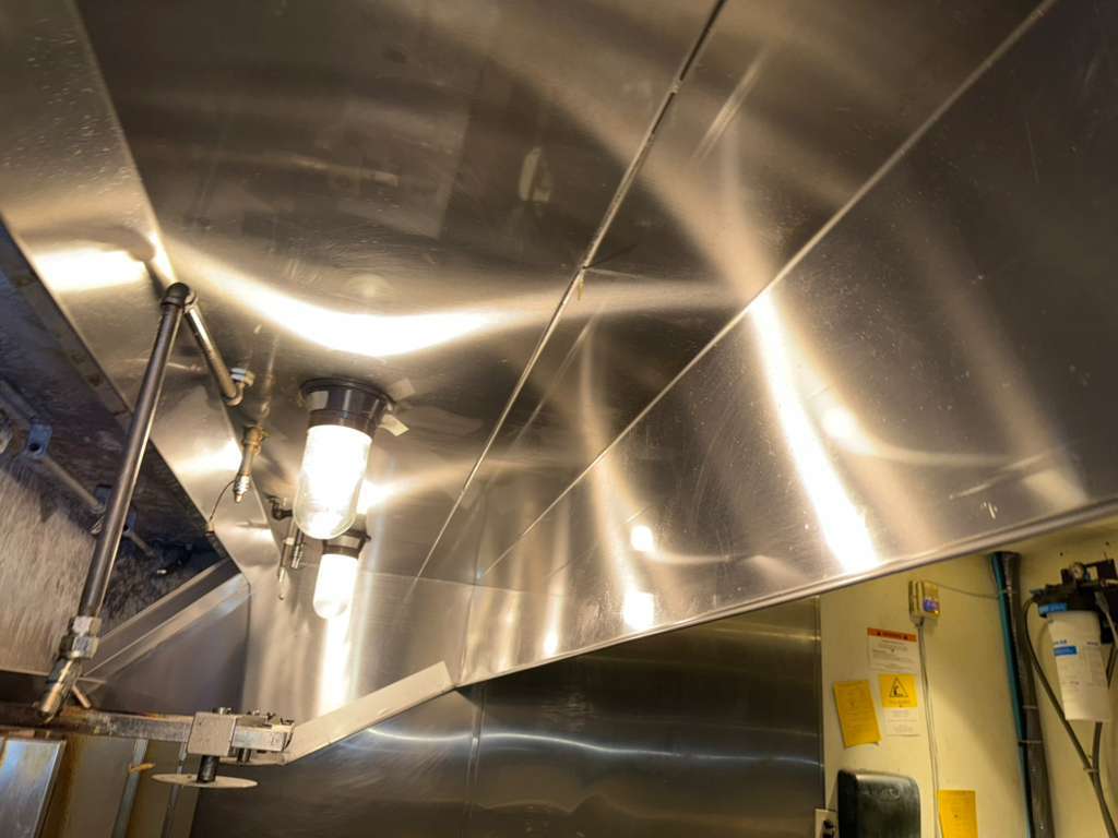 Commercial hood canopy degreased and cleaned after AFS service